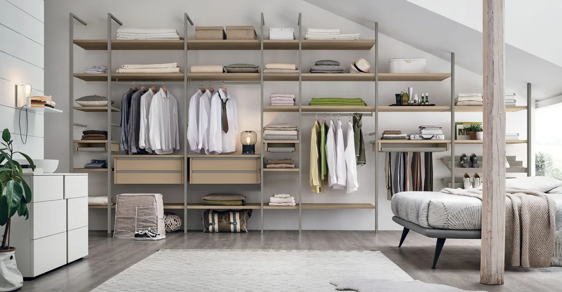 Walk-in wardrobe with open shelving in warm wood